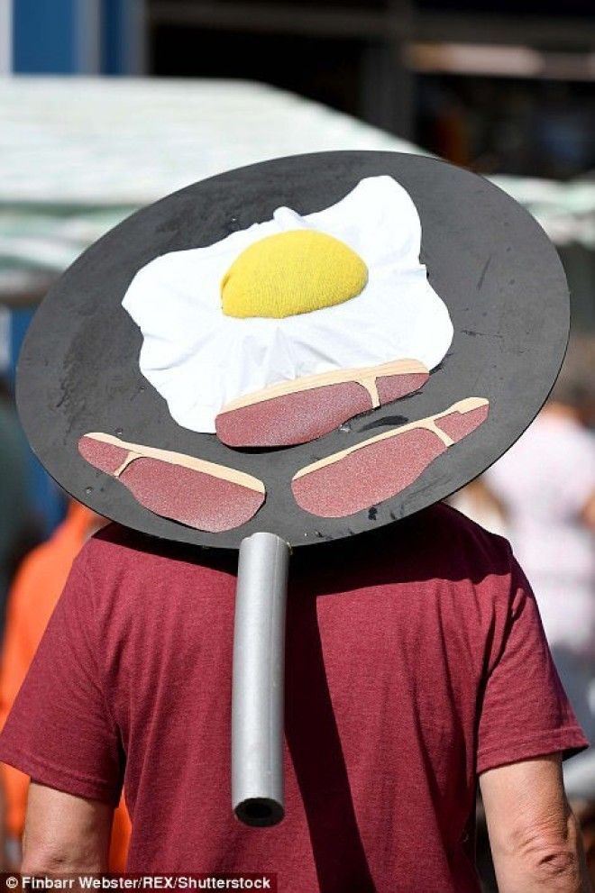 A man proudly dons a breakfast hat during the festival