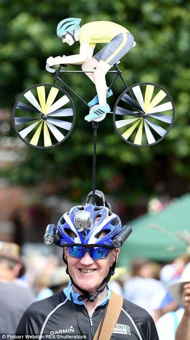 This avid cyclist (left) could not be more proud of his exquisitely-crafted headgear