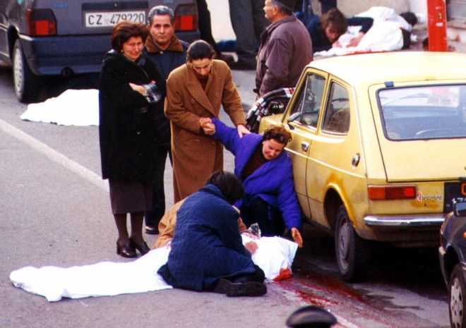 Relatives of the alleged 'Ndrangheta (Calabrian mafia) boss Salvatore Valente, 39, cry after Valente, together with two other suspected mobsters and a man caught in the crossfire, were killed in a shootout Saturday, Feb. 26, 2000 in Strongoli, Cotrone, Italy in this southern Italian town's main street