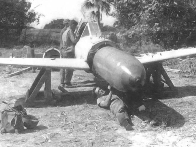 US Personnel conduct a warhead disassembly on a captured Yokosuka MXY7 Ohka in 1945