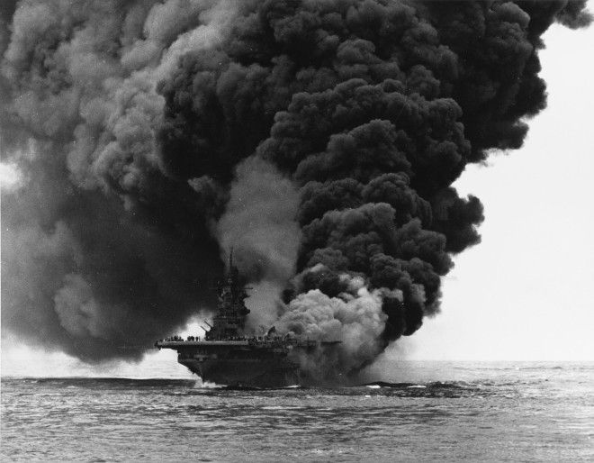 The U.S. Navy aircraft carrier USS Bunker Hill (CV-17) afire after being hit by two 